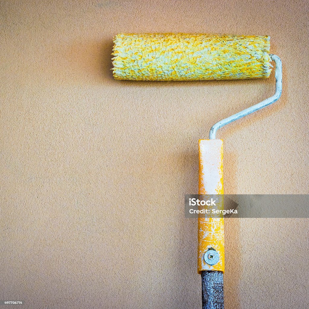 Paint Rollers Old paint roller on the background wall 2015 Stock Photo