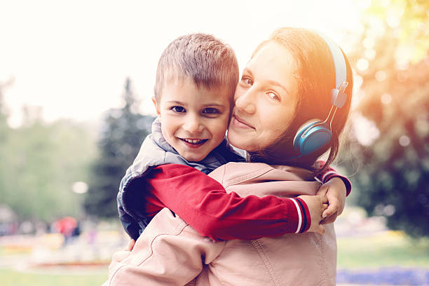 istock Brother and sister hugging 497707010
