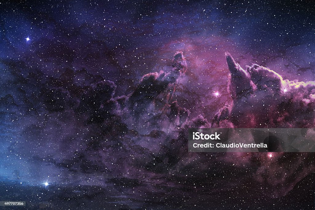 purple nebula and cosmic dust purple nebula and cosmic dust in star field Outer Space Stock Photo