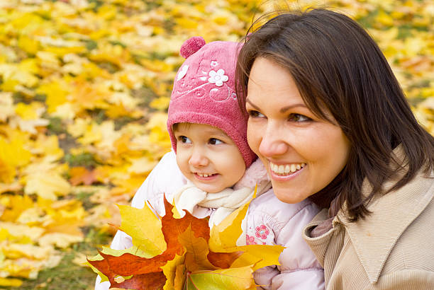 istock mom with daughter at park 497708176