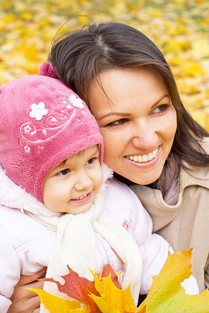 istock mom with daughter at park 497708266