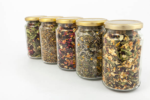 istock transparent glass jars of different herbs 497708653