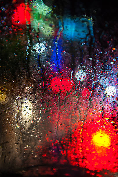 istock Autumn rain. wet night windows ， abstract background 497708789