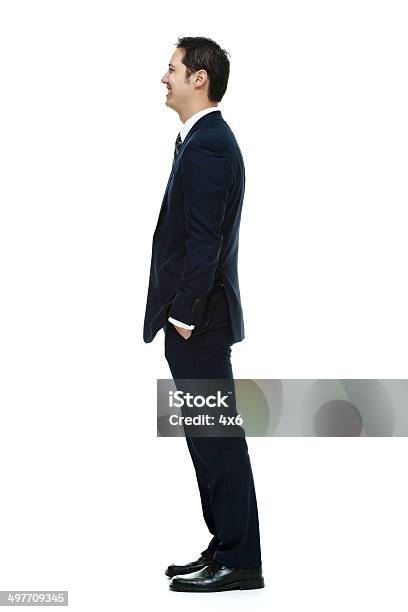 Lächelnd Geschäftsmann Wegsehen Stockfoto und mehr Bilder von Anzug - Anzug, Bürojob, Ein Mann allein