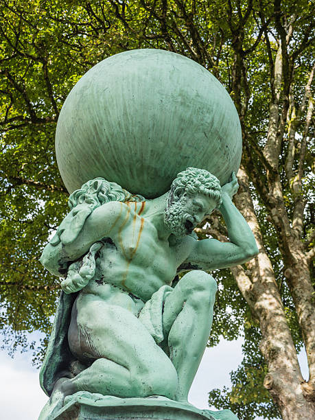 Statue representing Hercules Statue in the small Welsh village of Portmeirion representing Hercules, god of strength who traveled the world portmeirion stock pictures, royalty-free photos & images