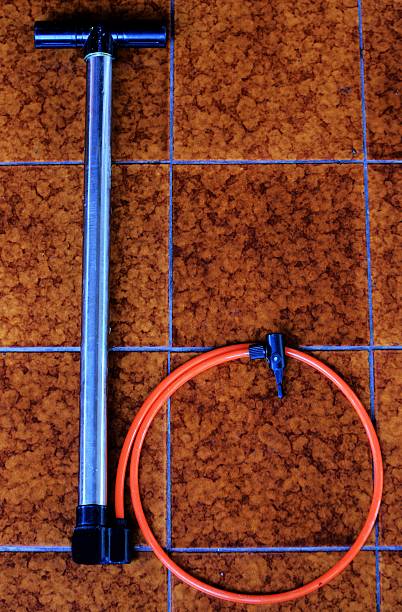 istock bicycle air pump on the orange tile 497710105