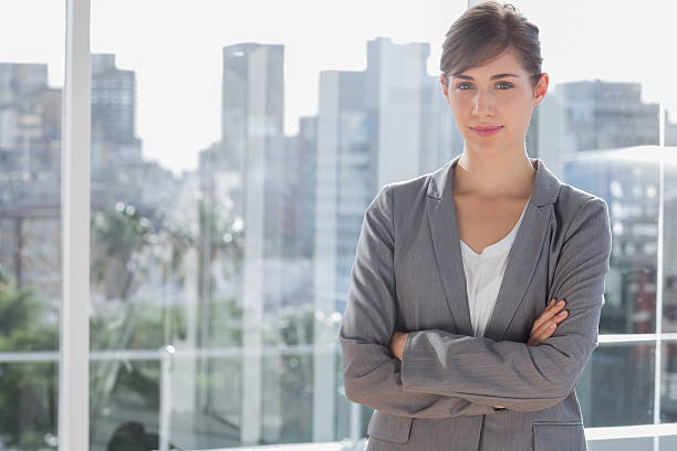 istock Happy businesswoman beside large window 497710271