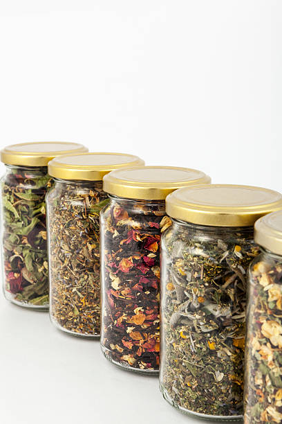 istock transparent glass jars of different herbs 497710961