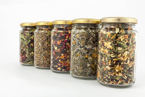 istock transparent glass jars of different herbs 497711211