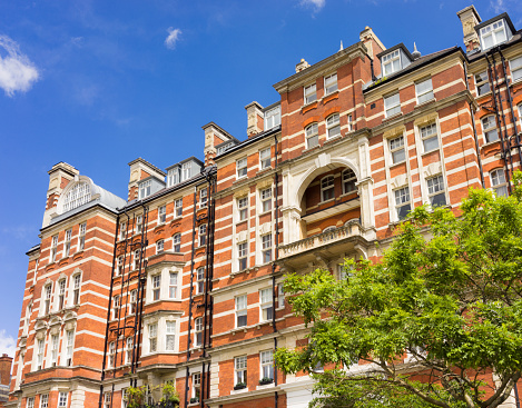 A large Victorian apartment building, located near the Albert Hall in South Kensington, London.