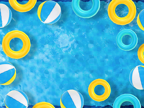 istock pool top view with swim rings and beach ball 497712210