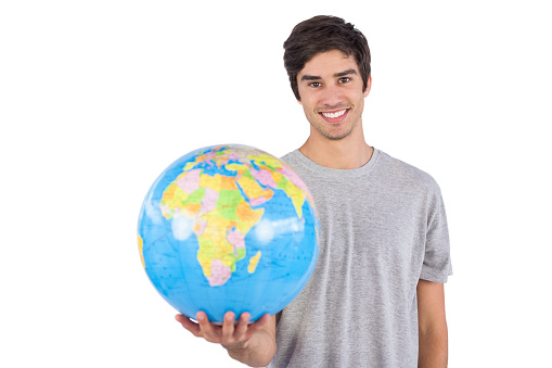 Man holding a globe on a white background