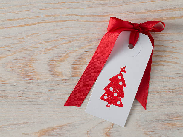 istock Christmas, gift tag, printed, red ribbon, background wood 497714156