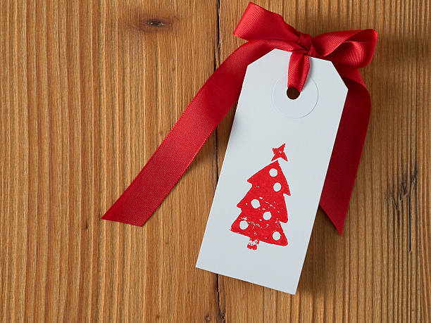 istock Christmas, gift tag, printed, red ribbon, background wood 497714216