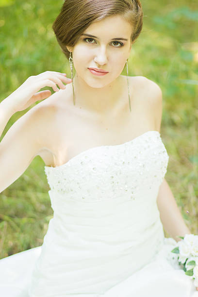 istock Portrait of a beautiful young bride in nature 497714241
