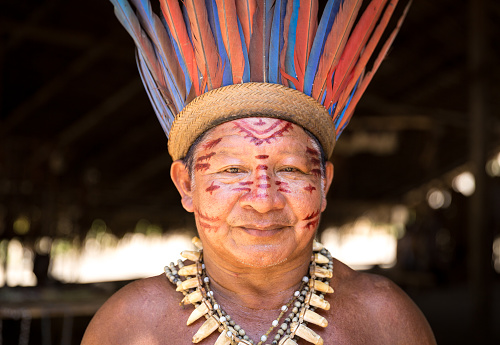 Native Brazilian old man portrait at an indigenous tribe in the Amazon