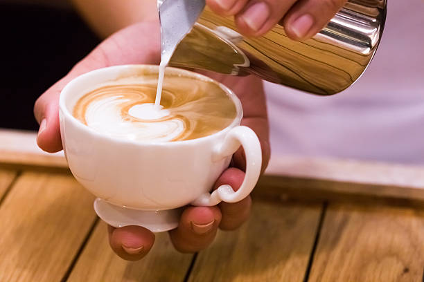 istock Charming young man enjoying aroma coffee in cafe 497715254