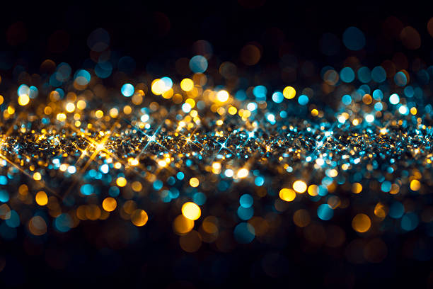 istock Yellow Blue Glitter on Black - Christmas Backgrounds Celebration 497740980