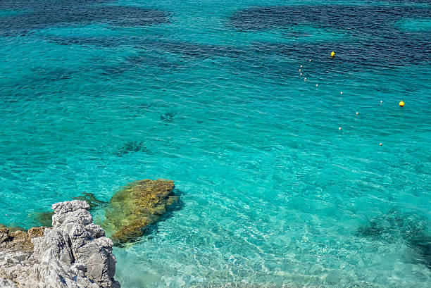 istock Clear Turquoise Sea Water and Stones. Greece. 497742188