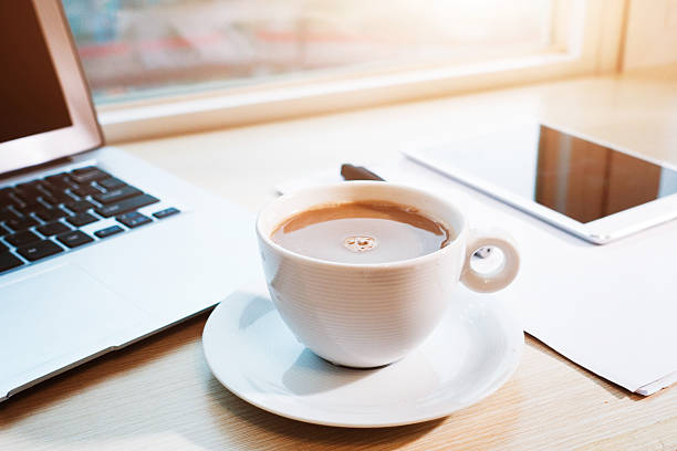 istock Laptop and a cup of coffee on office desk 497744668