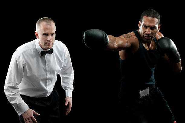 Professional Boxer A boxer on a black background boxing referee stock pictures, royalty-free photos & images