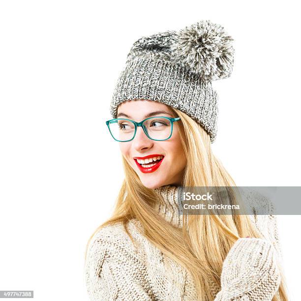 Smiling Hipster Girl In Winter Sweater And Hat On White Stock Photo - Download Image Now