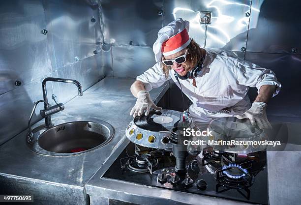Unusual Turntable On The Stove With Food Stock Photo - Download Image Now - Adult, Arts Culture and Entertainment, Bizarre