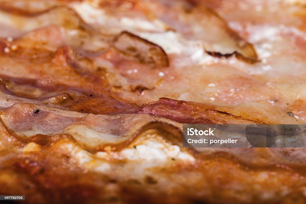 Pizza closeup close up shot of a delicious pizza with speck and smoked cheese Artichoke Stock Photo