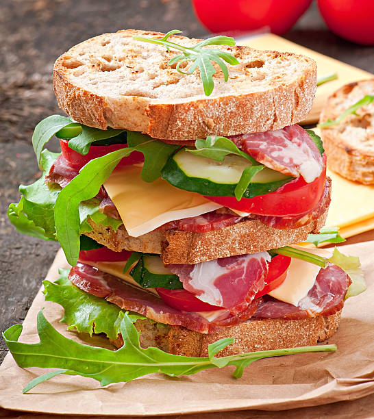 istock Sandwich with ham, cheese and fresh vegetables 497750837