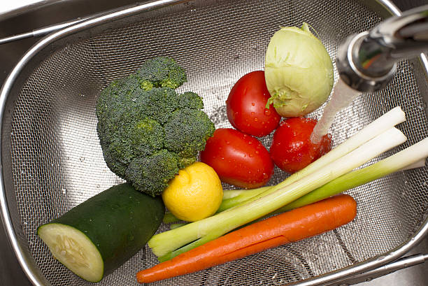 Wash your veggies stock photo