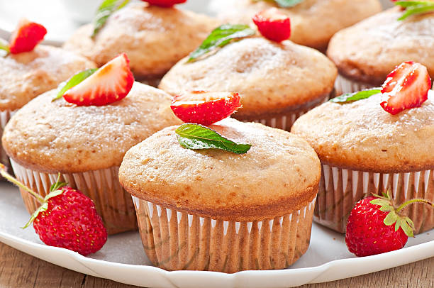 istock Strawberry muffin on a white plate with a fresh strawberry 497751843
