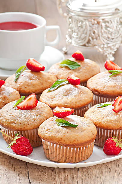 istock Strawberry muffin on a white plate with a fresh strawberry 497751847