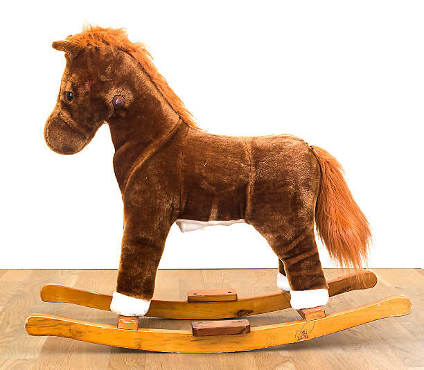 istock Rocking Horse on wood white background 497752511