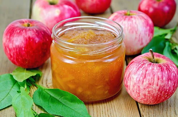 istock Jam apple with apples and leaves on the board 497753635