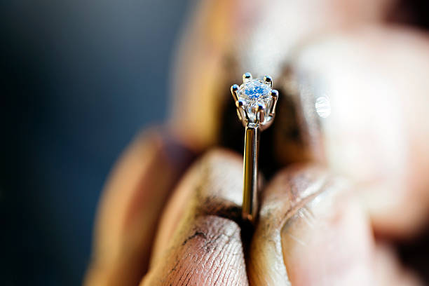 ring held by jeweler after polishing - hand gold jewels bildbanksfoton och bilder
