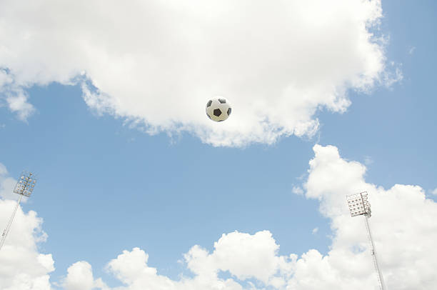 Football or soccer on blue sky.
