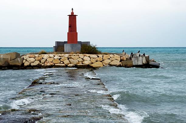 istock lighthouse in the Mediterranean Sea 497755631