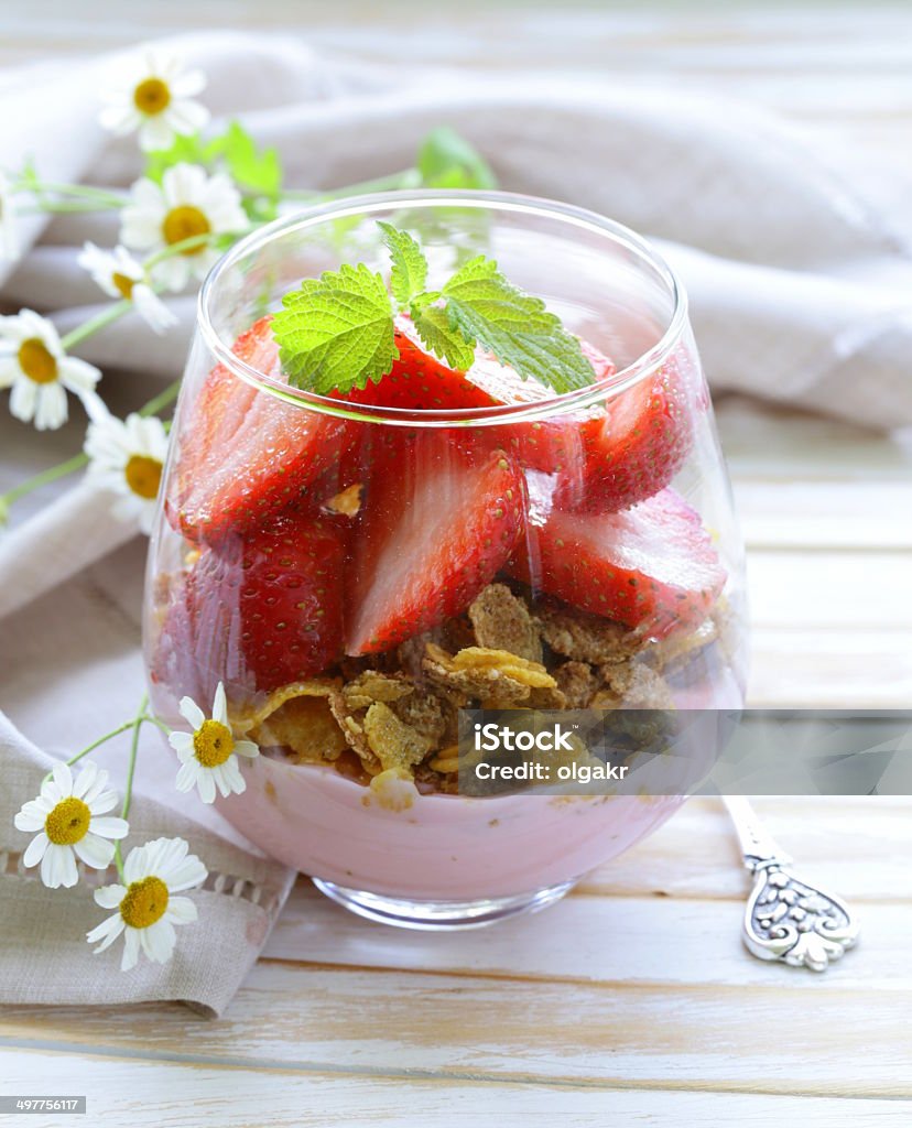 Dairy yogurt dessert with muesli and strawberries Breakfast Stock Photo