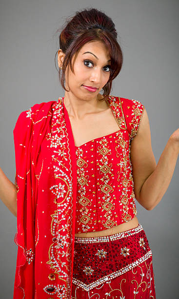 istock Young Indian woman shrugging 497756141