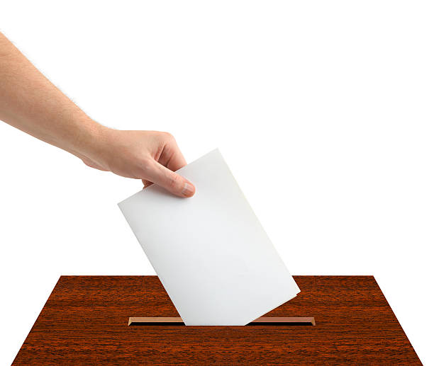 istock Hand with ballot and box 497778868