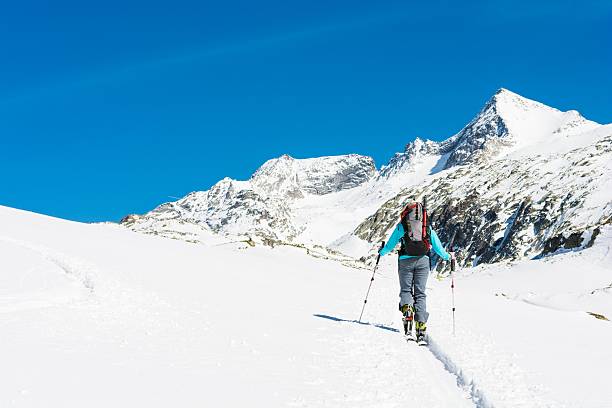 Ski touring in sunny weather. stock photo