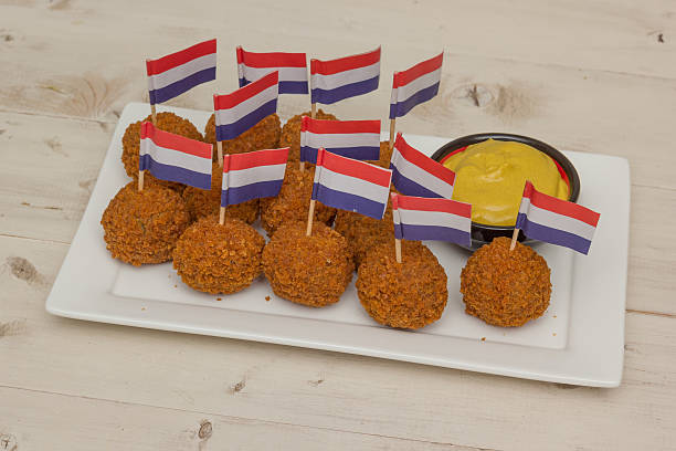 istock Dutch snack bitterballen with little dutch flags 497782130