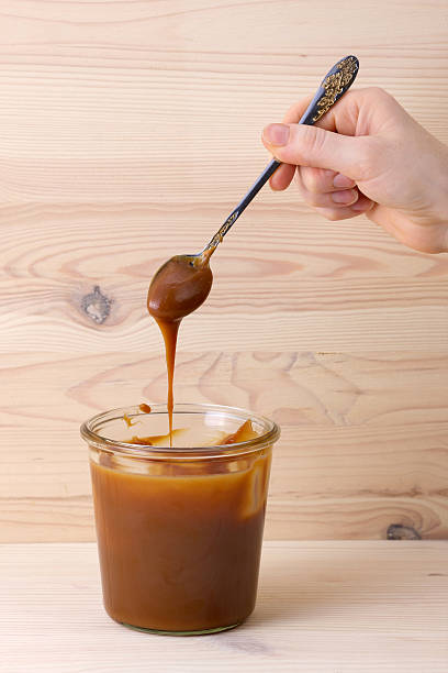 istock Spoon with salt caramel and jar 497782416