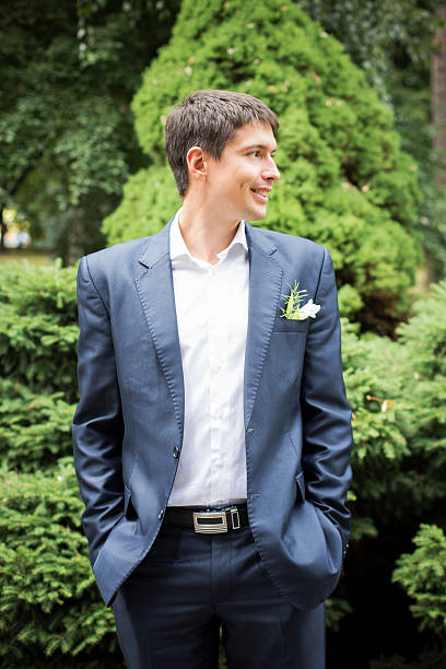 istock Groom in wedding gown at park. summer 497784416