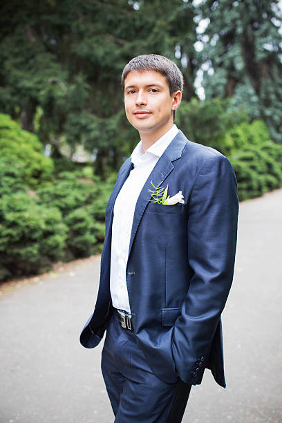 istock Groom in wedding gown at park. summer 497784452