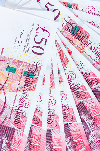 istock Fifty £50 pound sterling notes fanned out. 497785666
