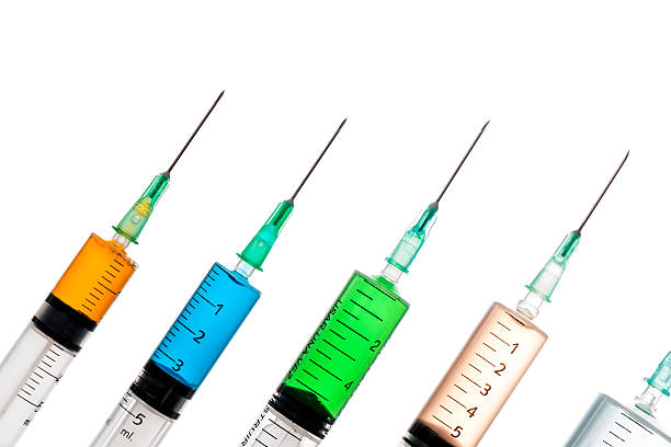 istock Various syringes filled with colored liquids 497786244