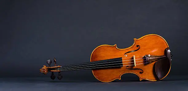 Photo of violin on black background
