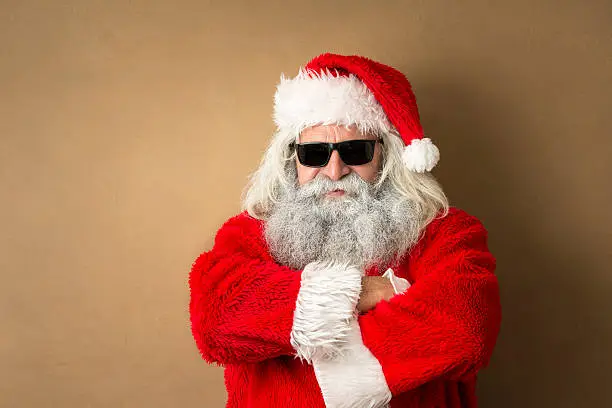 Photo of santa claus portrait with sunglasses