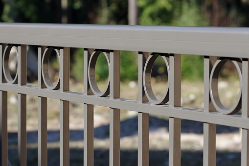 Brown painted custom aluminum railing on a high end home.